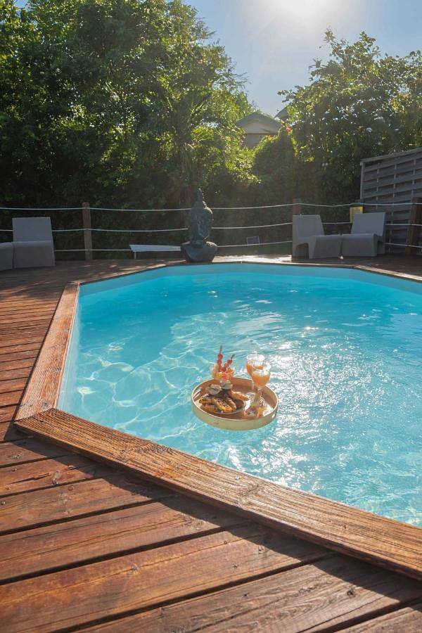 Location de vacances pour 12 personnes, avec vue ainsi que jardin et piscine dans Plage du Grand Macabou