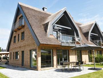 Strandhaus für 8 Personen, mit Garten und Balkon sowie Sauna, kinderfreundlich in Lobbe
