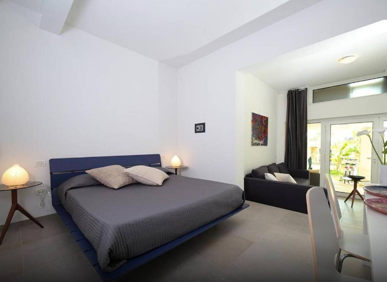 Chambre Quadruple Deluxe Bed and Breakfast Loggia degli Artisti avec piscine et climatisation in Palazzolo dello Stella, Province d'Udine