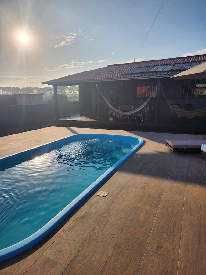 Casas e apartamentos de temporada para 6 pessoas, com jardim e piscina e ainda vista and balcão, com animais de estimação em Passo de Torres