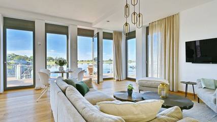 Ferienwohnung für 4 Personen, mit Terrasse und Seeblick sowie Sauna in Ummanz