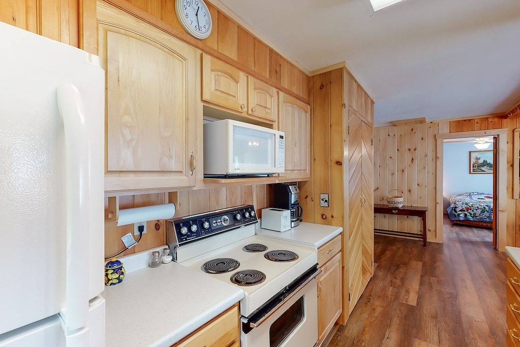 Lakefront home with private dock, mooring, pebble beach, grill, & firepit in Moosehead Lake