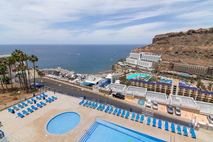 Ganze Wohnung, Ferienwohnung 'Stunning Sunset Ocean View' mit Meerblick, Gemeinschaftspool und WLAN in Taurito, Mogán