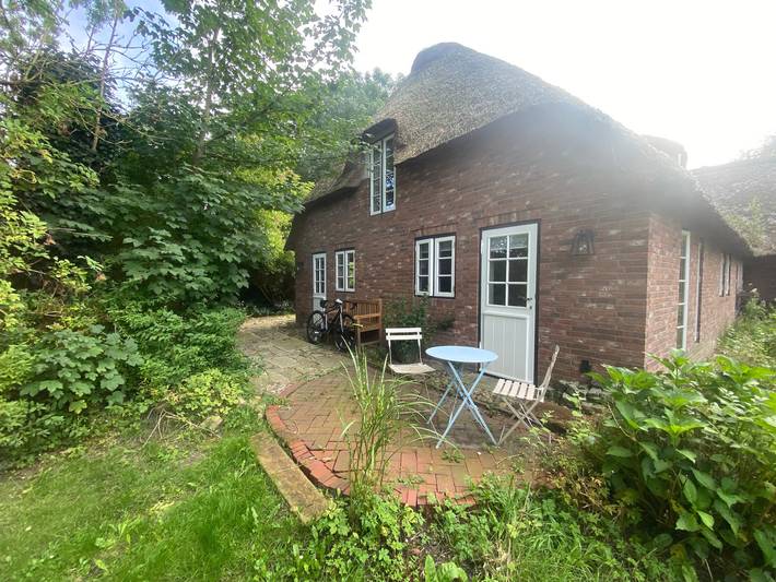 Appartement entier, Appartement "Reettraum" avec terrasse privée, jardin privé et Wi-Fi in Uphusum, Frise du Nord