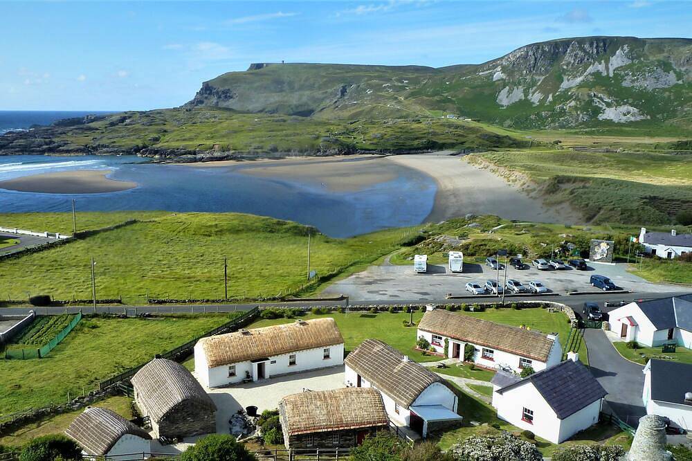 Teach Condy's Cottage nestled at the bottom of Sliabh Liag Cliffs, Co. Donegal in Donegal, County Donegal