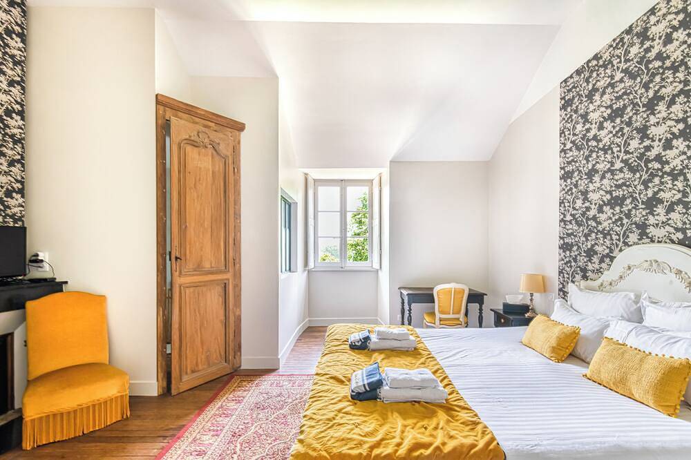 Lavishly decorated double room at Château Le Fresne in Bouchemaine, Angers region