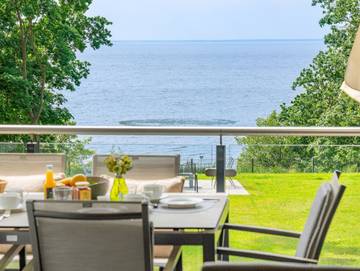 Ferienwohnung für 7 Personen, mit Garten und Sauna sowie Seeblick, kinderfreundlich in Garz