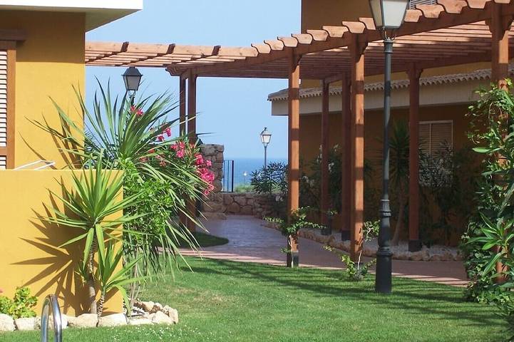 Location de vacances pour 4 personnes, avec jardin et piscine dans Punta Prima (Alicante)