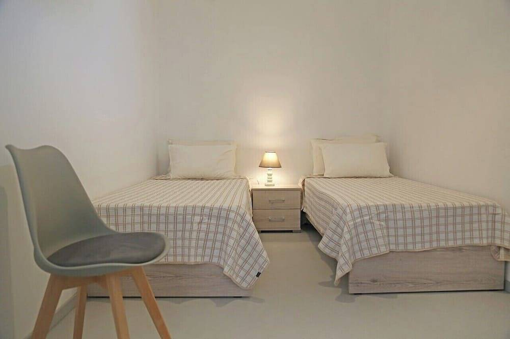 Olea Suite Syros offers unique sea views in a  house with parking and  Wi-Fi. in Poseidonia, Syros