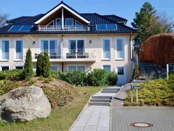 Ferienwohnung für 5 Personen, mit Terrasse und Sauna sowie Garten, kinderfreundlich in Neustadt in Holstein