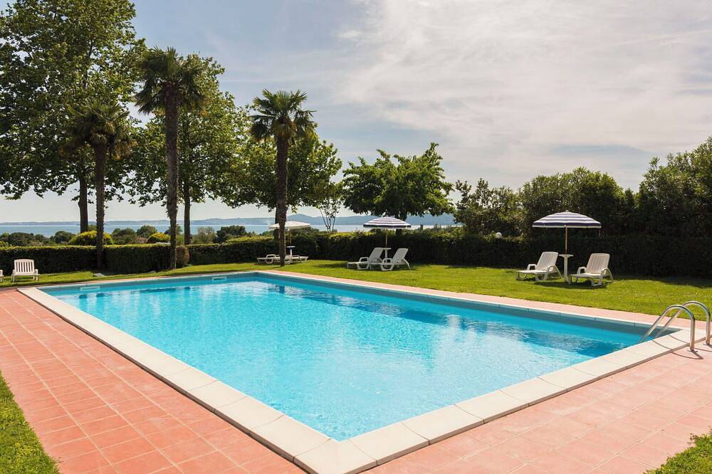 Bel appartement dans une maison de vacances avec WIFI, climatisation, piscine, TV, terrasse in Val di Lago, Bolsena