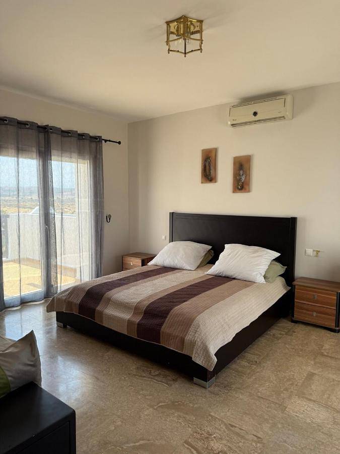 Casa de férias para 8 pessoas, com piscina e vista e ainda vista para o lago and jardim em Saïdia