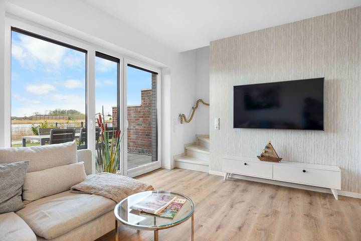 Ferienhaus für 4 Personen, mit Terrasse und Garten sowie Seeblick in Wangerland - 4