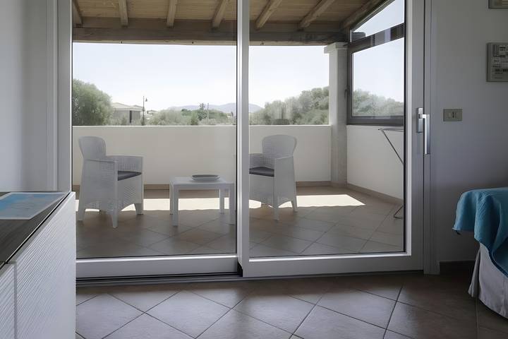 Apartamento entero, Apartamento 'Zio Tonino' con terraza privada, Wi-Fi y aire acondicionado in Pittulongu, Olbia