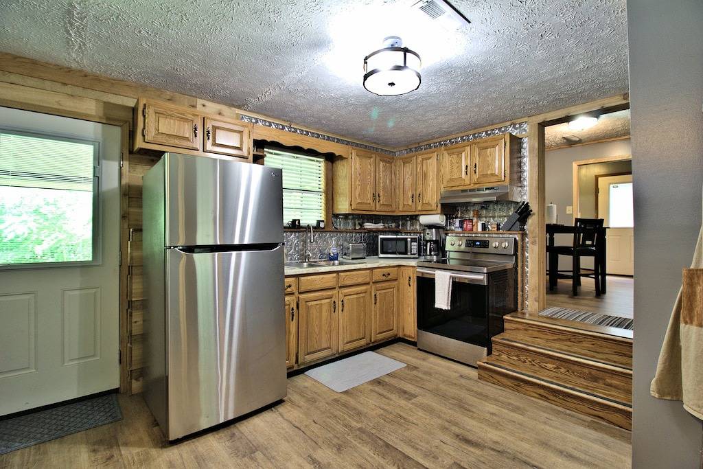 Moonshine Cabin with a nice yard on the creek in the shadows of the Smokies in Cocke County