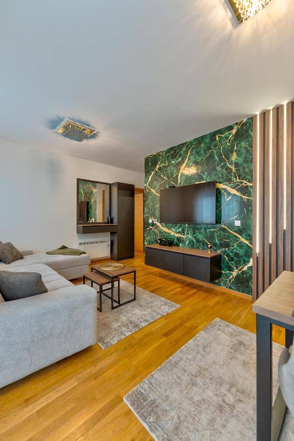 Appartement de vacances pour 4 personnes, avec Terrasse et Piscine ainsi que Sauna et Vue