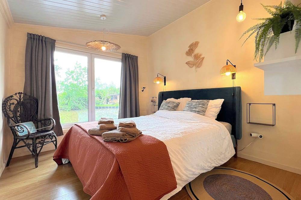 Knus chalet met terras aan het water in Geel, Antwerpen en omgeving