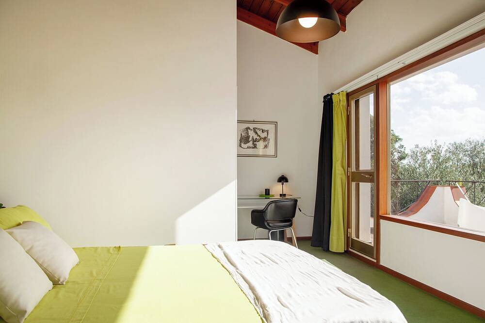 Villa surrounded by green hills overlooking the sea in Poggio dei Pini, Capoterra