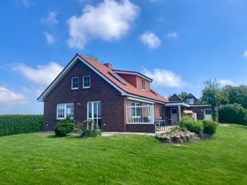 Ferienhaus für 9 Personen, mit Ausblick und Terrasse sowie Garten in Wangerland