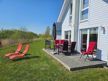 Ferienhaus mit Meerblick für 6 Personen, mit Ausblick und Sauna sowie Garten in Olpenitz