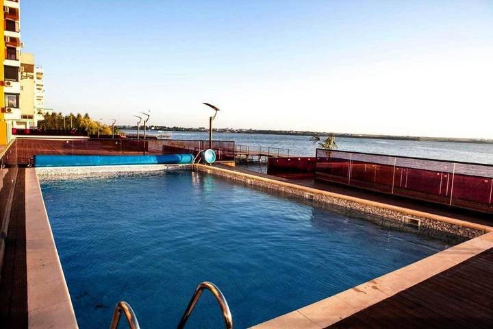 Appartement de vacances pour 4 personnes, avec Balcon et Terrasse ainsi que Jardin et Piscine