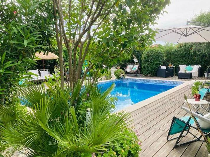 Appartement de vacances pour 2 personnes, avec piscine et terrasse ainsi que jardin et vue