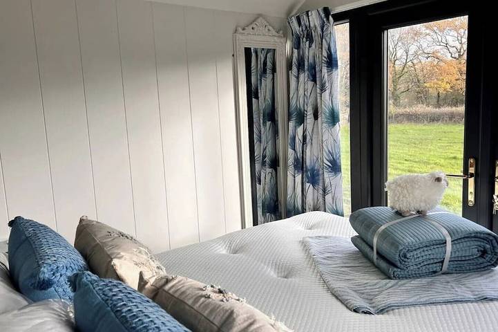 Boutique Shepherds Hut set in a wildflower meadow on a farm with Highland Cows in West Chiltington, South Downs
