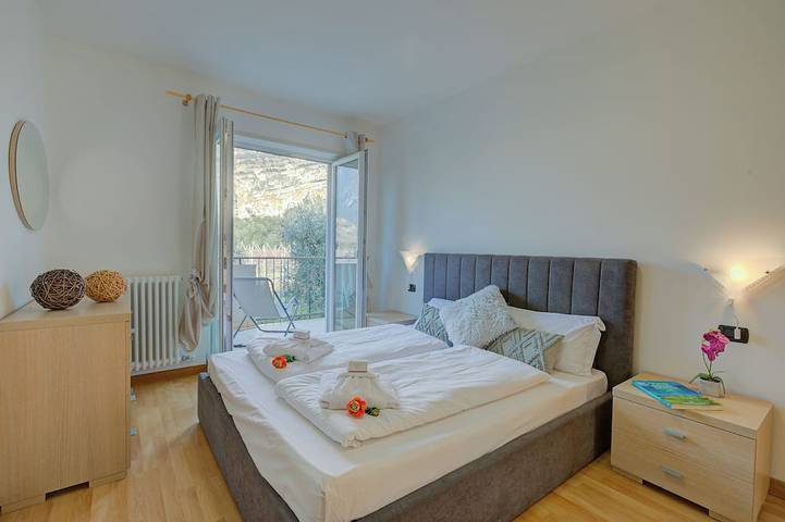 Entire apartment, Agritur Laura - Danza di colori 3 with Shared Garden, Torbole sul Garda, Italy in Torbole, Nago-Torbole
