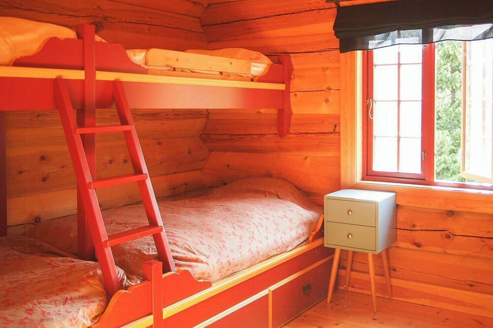 Cabin with wooden interior by Lake Tinnsjøen in Tinn