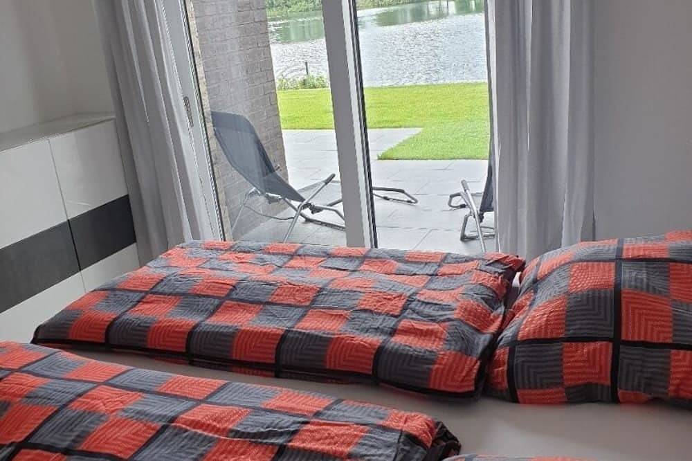 Ferienhaus direkt am See mit Sauna, Klimaanlage und privat Strand in Barßel, Oldenburger Münsterland