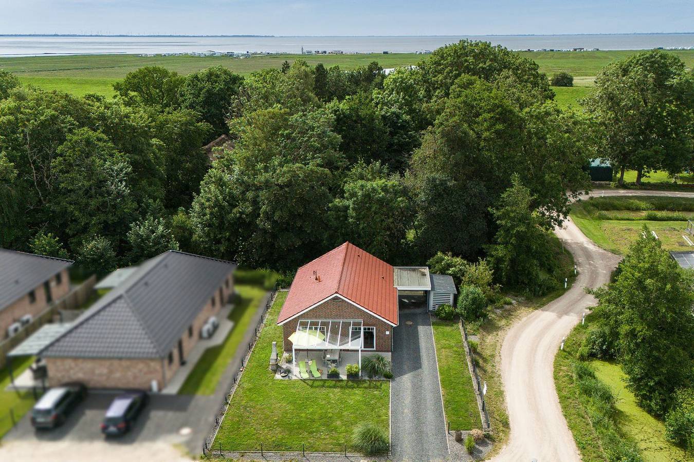 Haus Deichoase mit Garten, überdachter Terrasse und Infrarotsauna an der Küste in Sehestedt (Jade), Jade