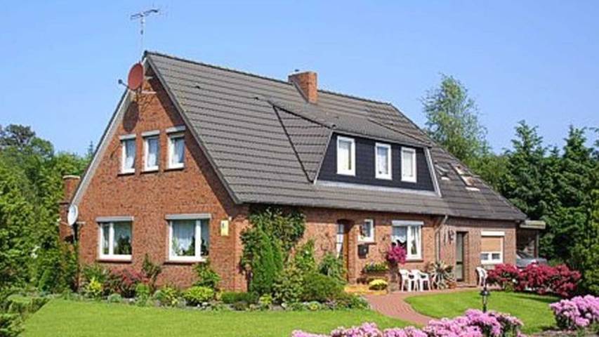 Ferienwohnung für 3 Personen, mit Garten und Balkon, kinderfreundlich in Dunum