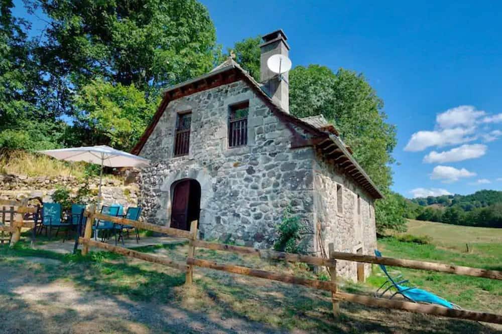 Isolated mill on river bank in Mur-de-Barrez, Aveyron