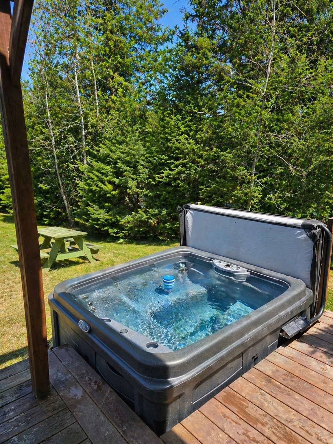 Spa  private pond and beach volleyball Citq 248080 in Lac-Supérieur, Quebec