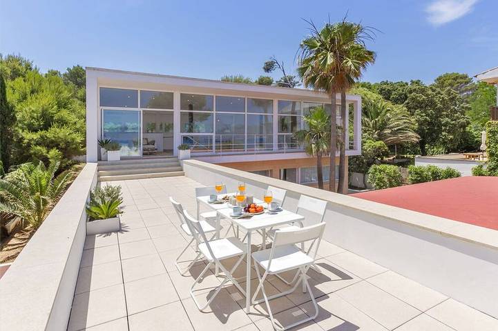 Casa de vacaciones para 10 personas, con jardín y balcón en Playa de Sant Joan