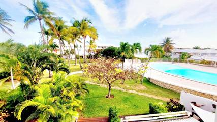 Gîte pour 3 personnes, avec vue ainsi que jardin et piscine dans Golf international de Saint François