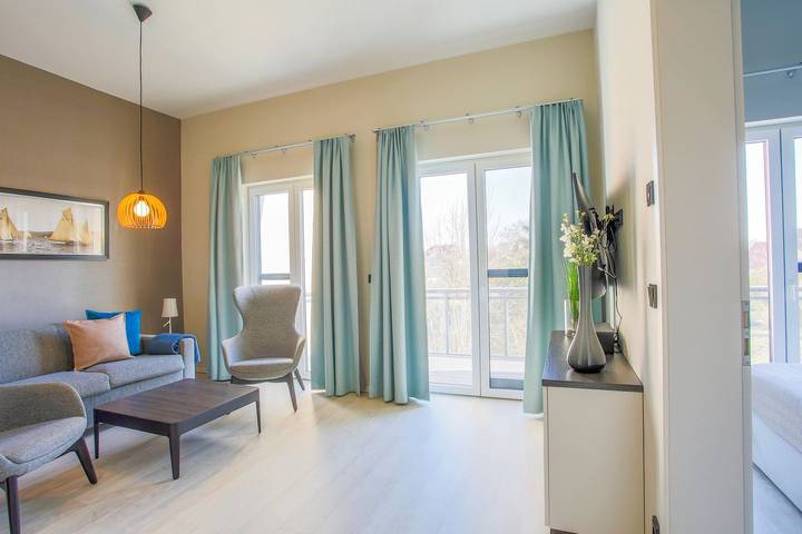 Ferienwohnung für 4 Personen, mit Balkon und Sauna sowie Seeblick in Wustrow