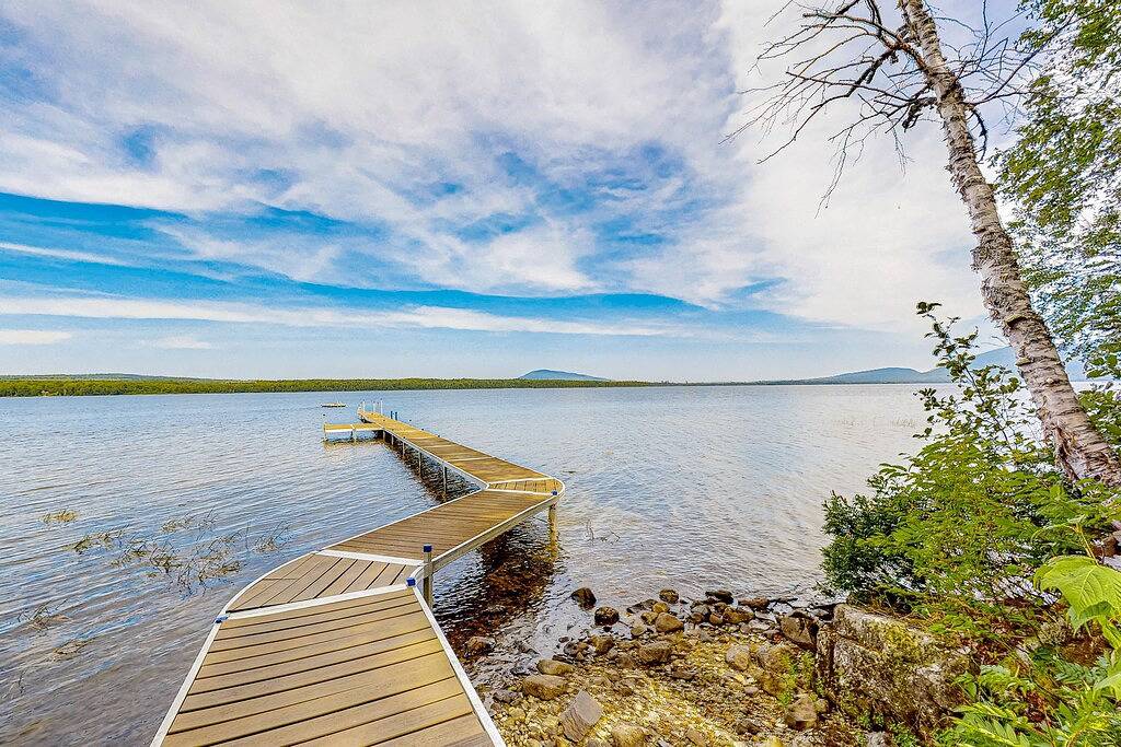 Lakefront cabin on First Roach Pond with dock, lake view & firepit- dog-friendly in Piscataquis County