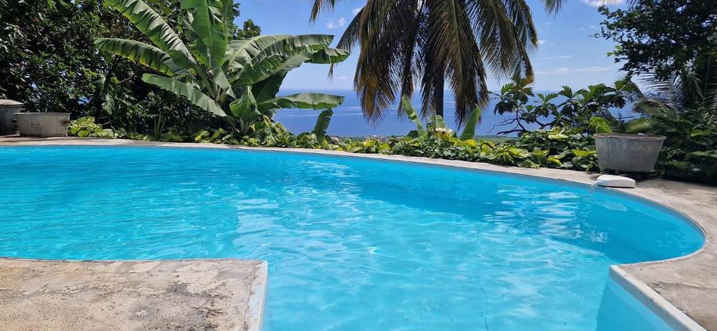 Appartement de vacances pour 4 personnes, avec jardin ainsi que vue et piscine