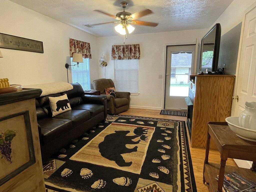 Downtown by Chattahoochee River, sit on front porch as horse and buggy stroll by in Helen, Chattahoochee National Forest