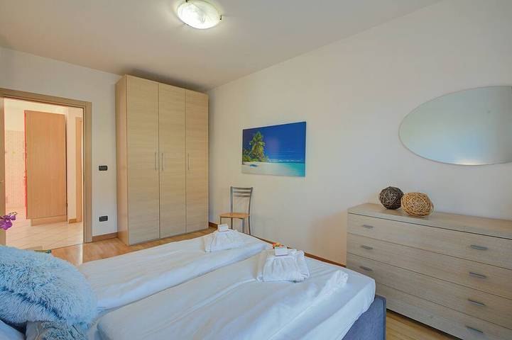 Entire apartment, Agritur Laura - Danza di colori 3 with Shared Garden, Torbole sul Garda, Italy in Torbole, Nago-Torbole