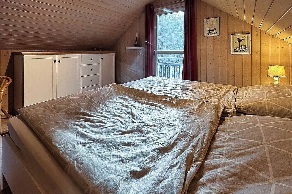 Ferienhaus Villa Hügel 222 in Baabe mit Meerblick. Kinderfreundliche Ausstattung. Stilvolles Wellnessbad mit Sauna & Whirlpool. Ladestation für Elektroautos – ideal für eine komfortable Anreise in Strand Baabe, Baabe