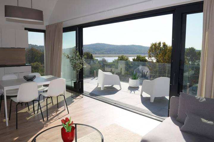 Ferienwohnung für 4 Personen, mit Garten und Sauna sowie Seeblick und Ausblick - 1