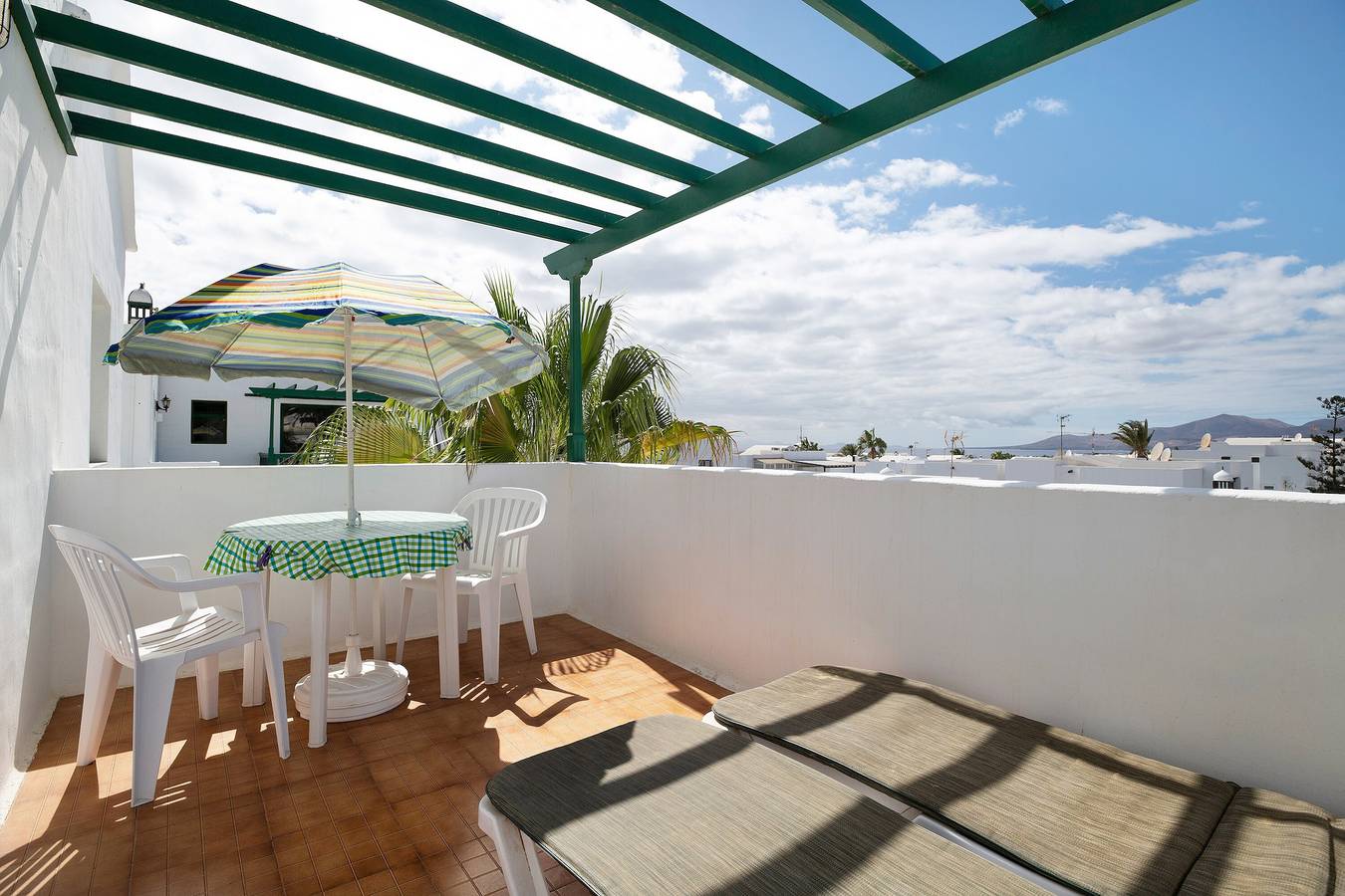 Entire apartment, "Apt6 Las Palmeras Iii Lanzarote" with Sea and Mountain Views, Shared Pool & Private Terrace in Puerto del Carmen, Tías