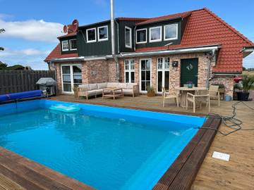 Ferienhaus für 4 Personen, mit Ausblick und Terrasse sowie Garten in Norden