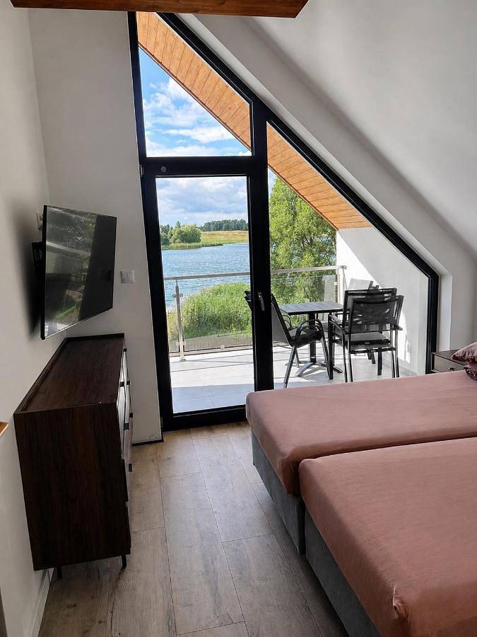 Nad Samą Wodą Villa Luksusowy dom nad Jeziorem z prywatnym pomostem i jacuzzi in Pasym, Mazury