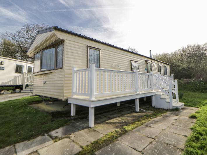 Caravan for 4 people, with garden in Cardigan Bay
