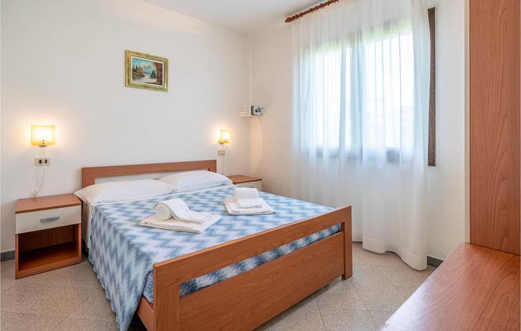 Appartamento fronte spiaggia con piscina e parcheggio in Albarella, Rosolina