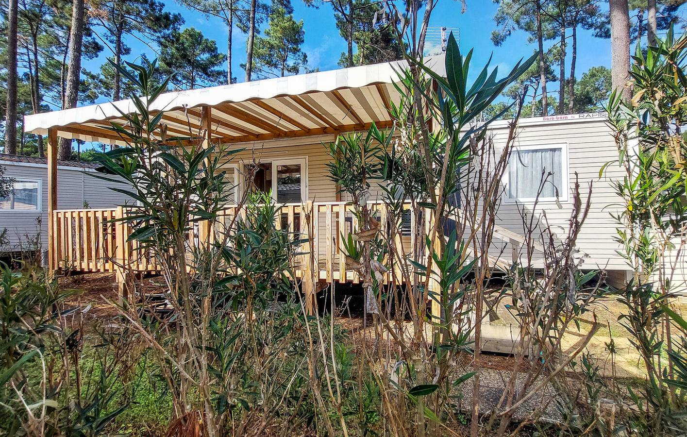 Acogedora casa móvil con lavadora y parque infantil, ¡a un paso de Dune Seule Bouchée! in Saint-Julien-en-Born, Côte d’Argent