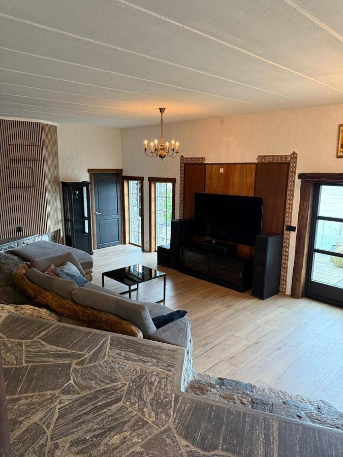 Ferienhaus für 7 Personen, mit Pool und Terrasse sowie Ausblick, mit Haustier in Austrheim